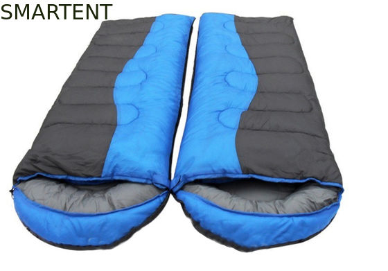 Comprar 215 * 78CM de doble color exterior impermeable a agua 190T poliéster relleno de fibra hueca clásico dos personas en un saco de dormir Fabricación en línea